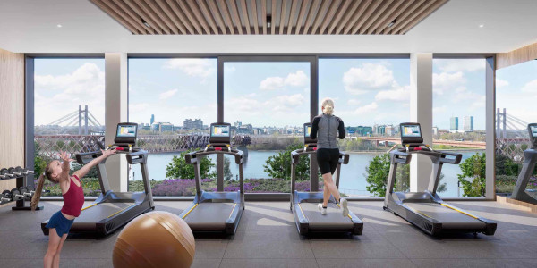 Residents of BW Hudson working out in the modern gym