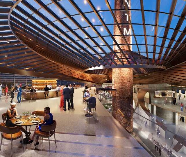 Ljudi sede u kafiću u okviru Muzeja Nikole Tesle u Beogradu na vodi.