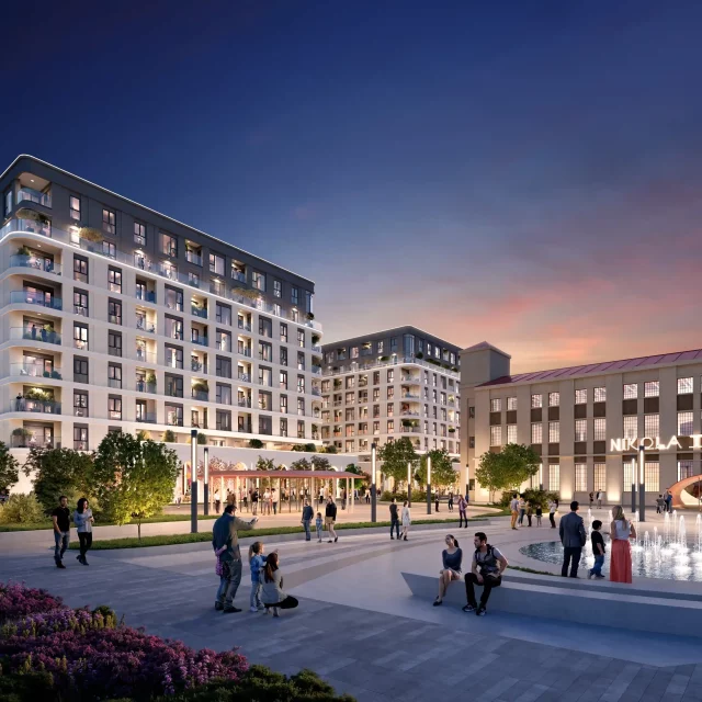 Plaza with a fountain in front of the Nikola Tesla Museum and BW Neon in the evening hours.