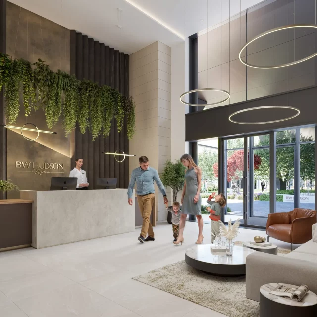 Porodica ulazi u zgradu BW Hudson u Beogradu na vodi.