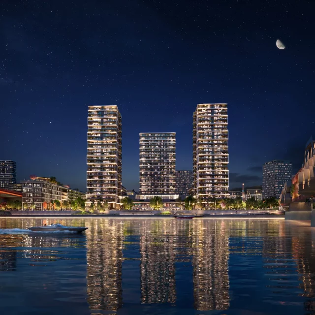 Eksterijer zgrada BW Lena i BW Hudson obasjani svetlima tokom noći.