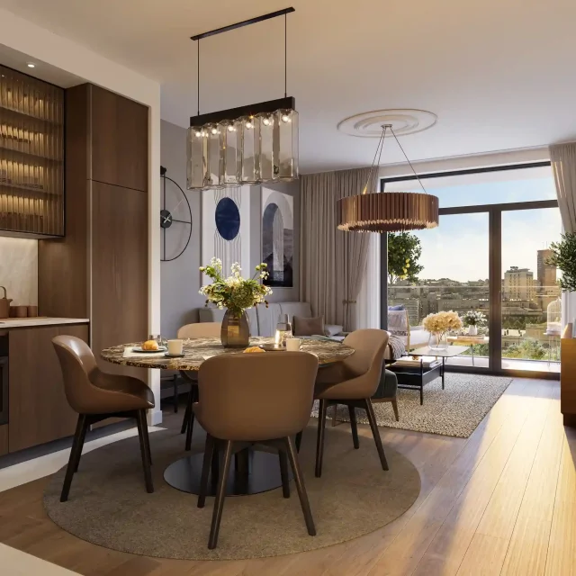 Open-plan kitchen with dining area and living room in the BW Prima building.