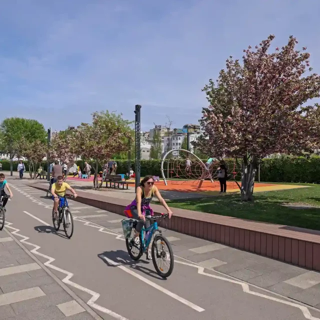Family bike ride along the Sava Promenade in Belgrade Waterfront.